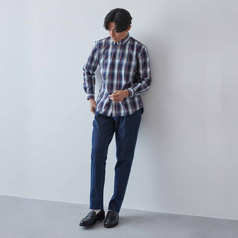 A trendy traditional style that combines a madras check shirt with denim pants.